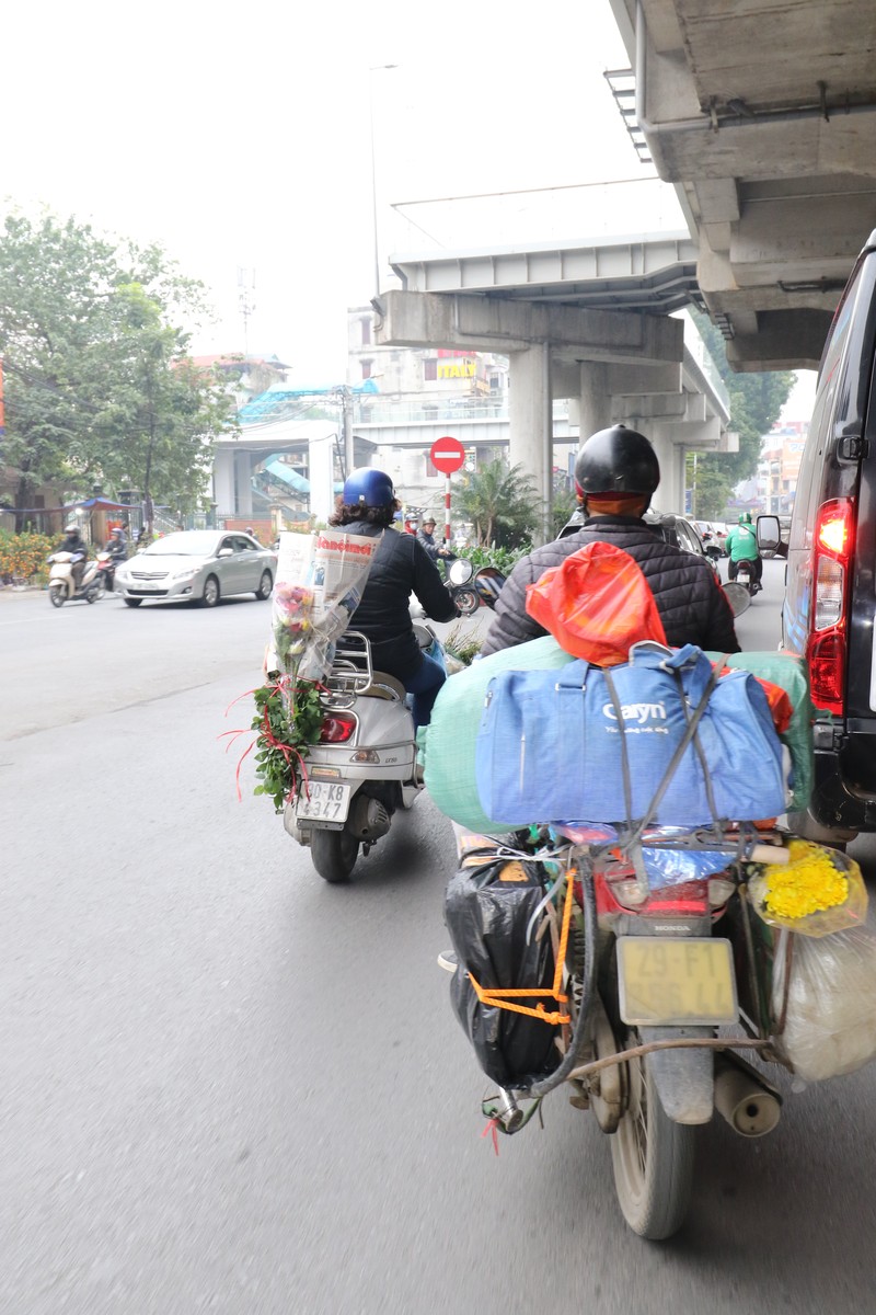 Chum anh: Nguoi dan do dac linh kinh chay xe may roi thanh pho ve que an Tet-Hinh-4